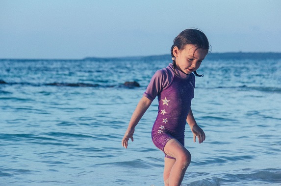 girl playing in the sea