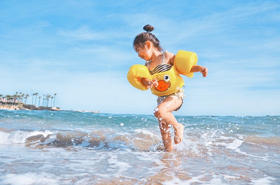 girl playing on the beach