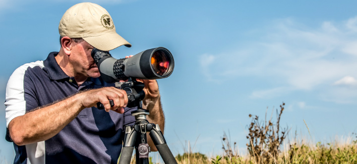 man with scope in nature