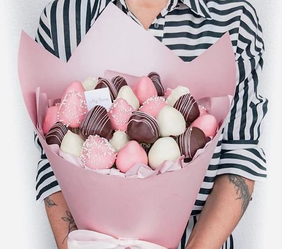 woman holding chocolate bouquet