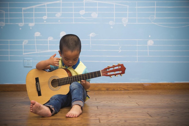 small kid with guitar