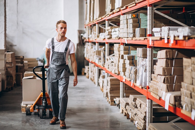 worker works with hand truck