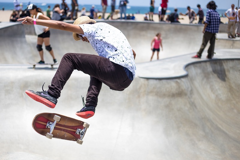 people skateboarding in skateboard park