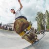 picture of a man riding a skateboard in skateboarding park