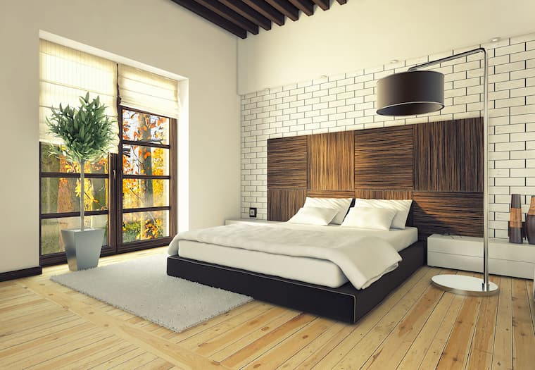 bedroom with wood details and large brown lamp