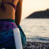 picture of woman sitting on the beach