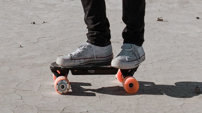 guy riding an electric skateboard