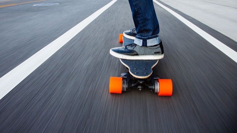 riding an electric skateboard