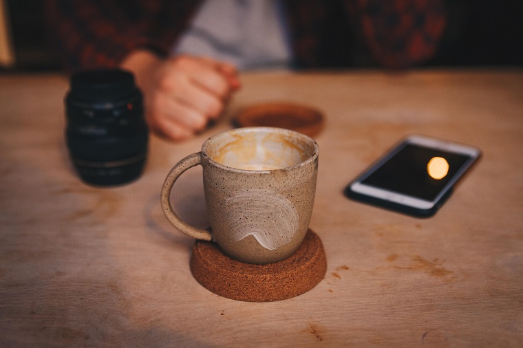 brown handmade mug on wooden table