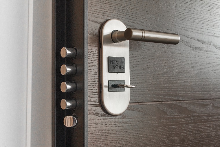 door lock with key on wooden door