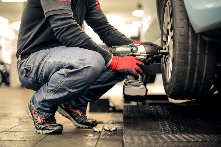 mechanic changing tire