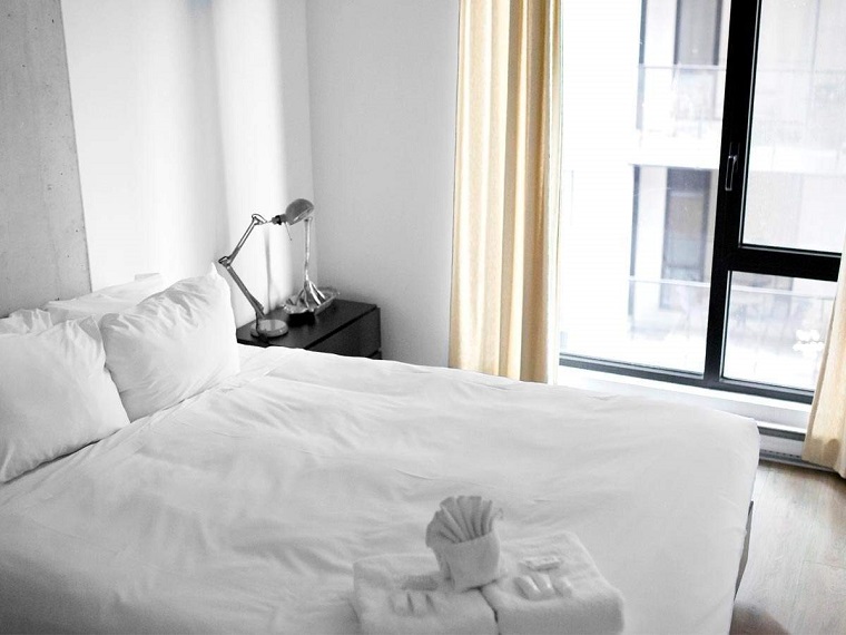 white bedroom with white sheets