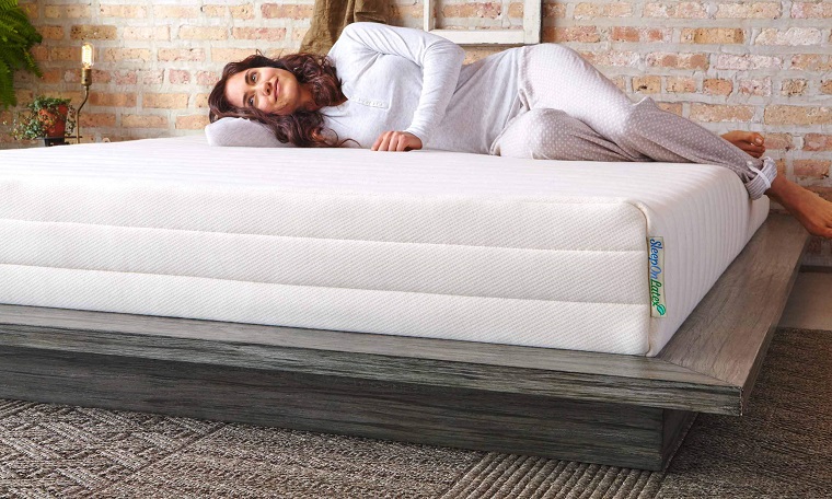 woman laying on latex mattress 