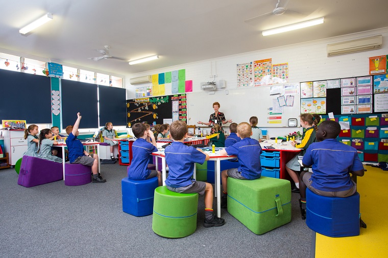 Students seating on flexible furniture in classroom
