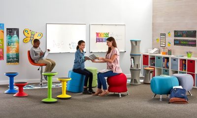 teacher discussing with student in classroom