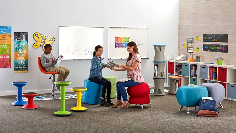 teacher discussing with student in classroom