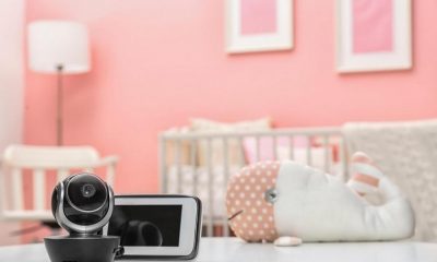 picture of a baby monitor beside a crib
