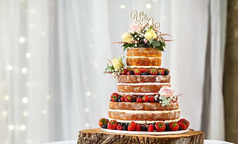 naked wedding cake with strawberries