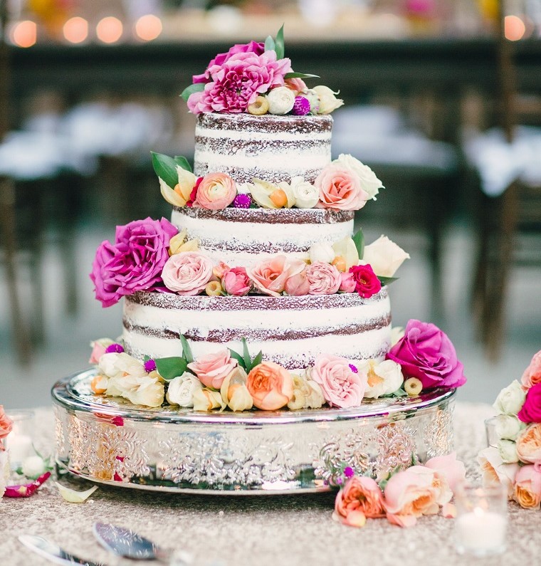 naked wedding cake with pink flowers