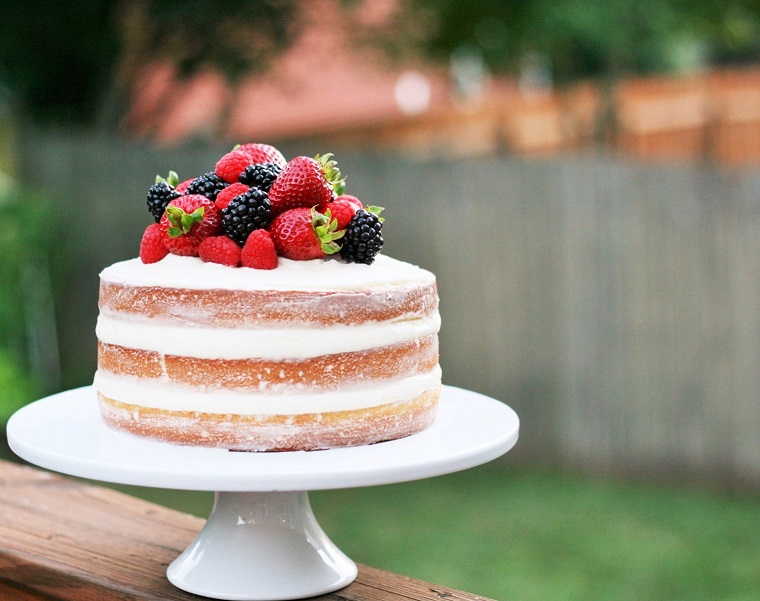 naked cake with berries on top 