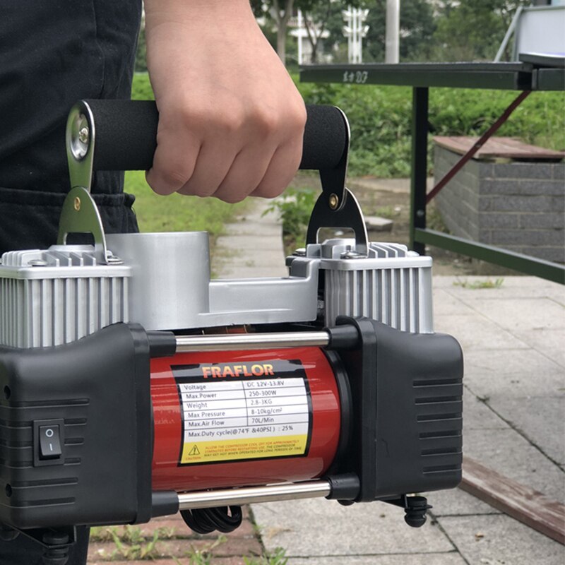 Man holding 12V air compressor