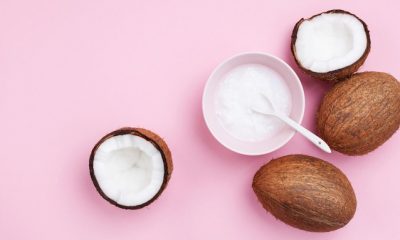 coconuts fruit with coconut oil on pink pastel image