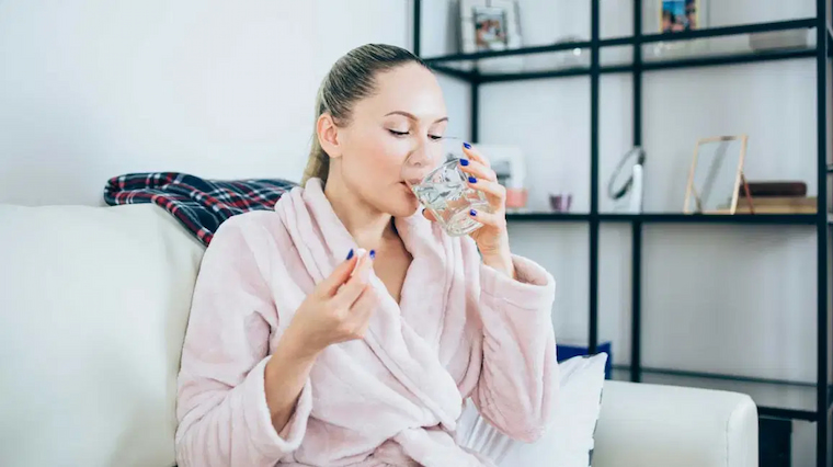 girl taking magnesium pill
