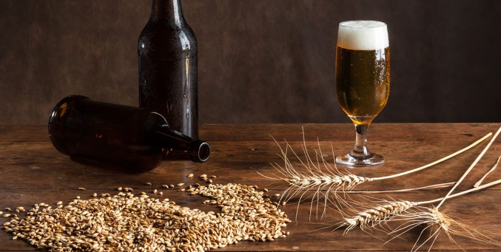 glass of beer on the table with wheat malt