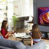 picture of a family in front a 48 smart tv in a living room