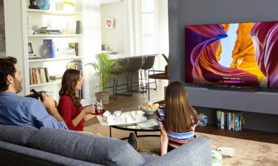 picture of a family in front a 48 smart tv in a living room