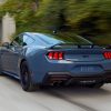 Blue Ford Mustang on road