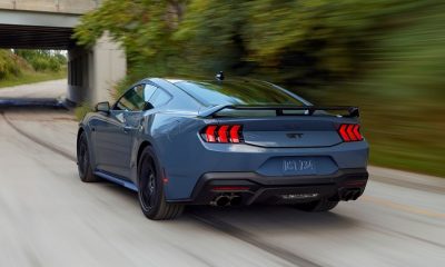Blue Ford Mustang on road