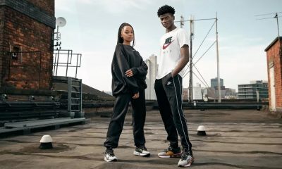 man and woman wearing nike outfits