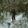 a person in the wild hunting with shotguns